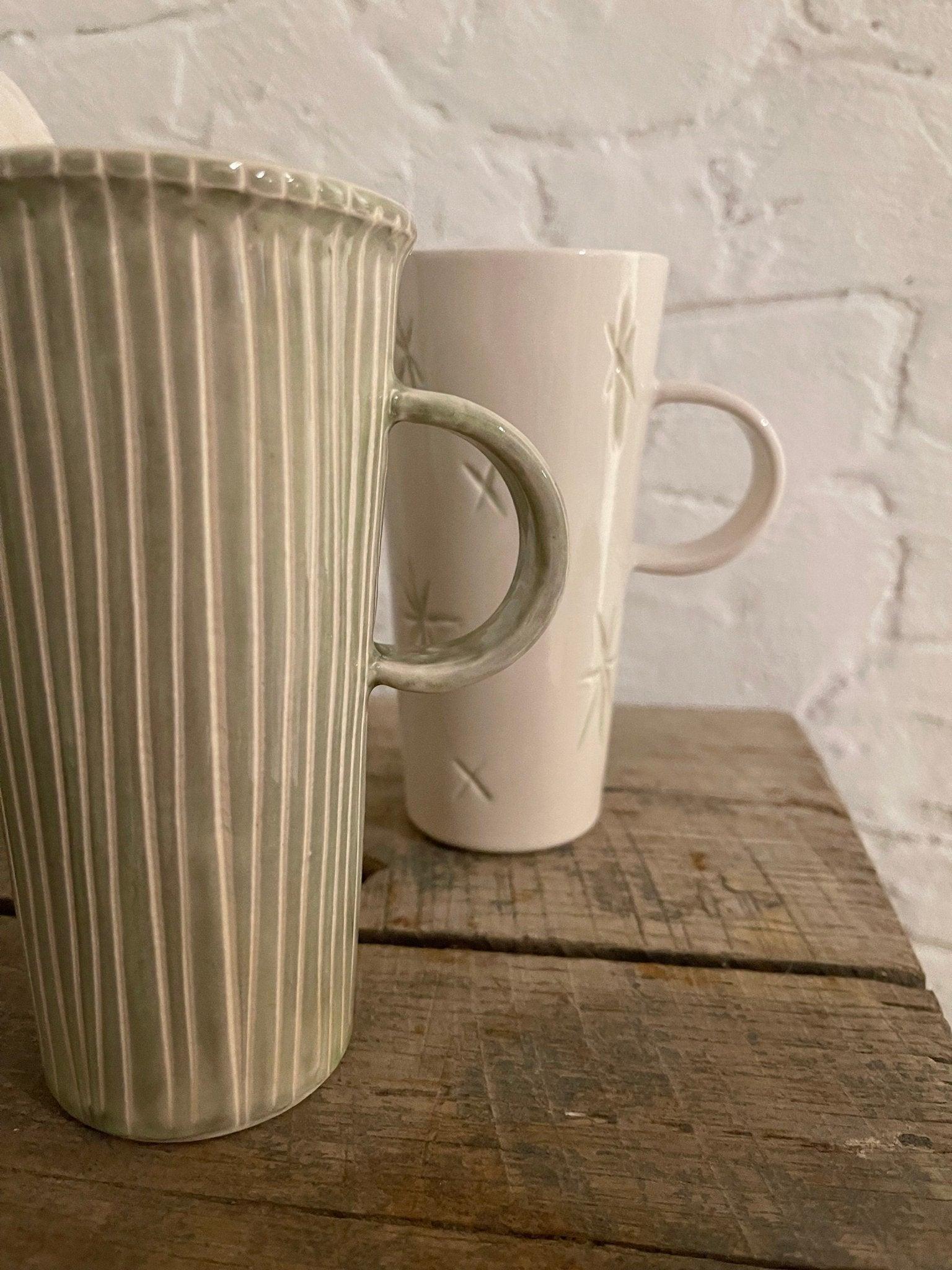 Handmade tall stoneware mug with star or stripe design