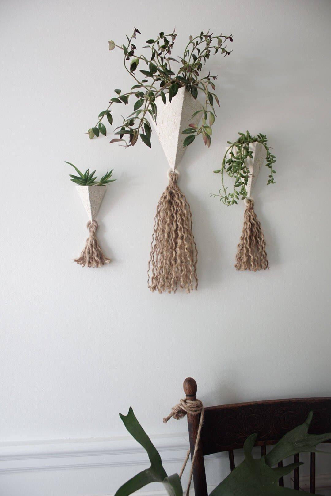Handmade ceramic pyramid wall planter with a jute tassel