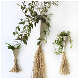 Handmade ceramic pyramid wall planter with a jute tassel