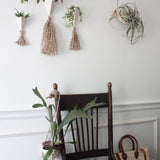 Handmade ceramic pyramid wall planter with a jute tassel