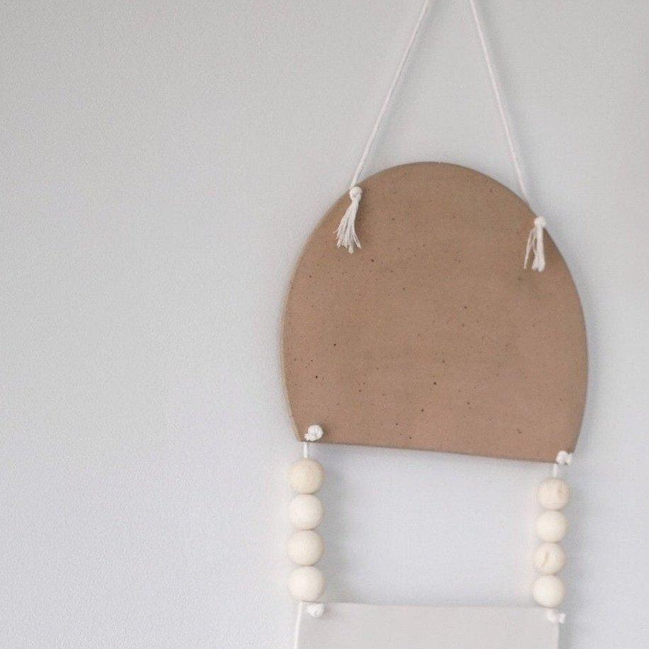 Handmade stoneware tribal wall art hanging in neutral tones by Muddy Heart