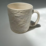 Handmade wide ceramic mug with frosted wheat-textured exterior